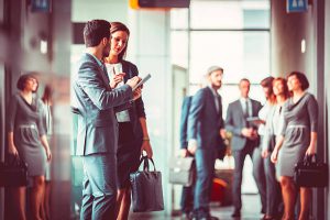 Group of business people in the office building lobby.
